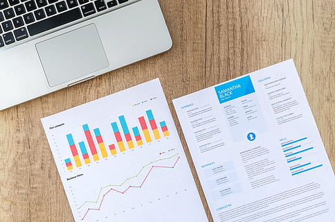 two, white, printer papers, macbook, brown, surface, analysis, analytics, application, business plan, charts, curriculum vitae, cv, data, graphs, job, laptop, marketing, paper, papers, recruitment, report, research, resume, statistics, top view, wooden surface, work, working, computer, graph, wireless technology, business, diagram, table, chart, technology, communication, finance, office, connection, indoors, bar graph, desk, high angle view, multi colored, no people, using laptop, analyzing, note pad, 5K