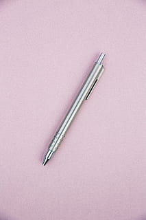 gray click pen, pen, paper, pink, silver, tool, topdown, flat, single, poem, open, office, notebook, minimal, lyric, ideas, idea, home office, handwriting, writer, empty, still life, studio shot, indoors, cut out, metal, no people, high angle view, copy space, single object, silver colored, close-up, writing instrument, two objects, pink color, colored background, work tool, education, table, luxury, 5K, CC0, public domain, royalty free