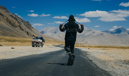person, walking, holding, hat, strap, adventure, daylight, desert, fun, ladakh, landscape, mountain, road, skateboard, transportation, full length, rear view, mountain range, one person, mode of transportation, sky, cloud - sky, nature, travel, day, scenics - nature, leisure activity, adult, environment, motorcycle, real people, outdoors, 4K, CC0, public domain, royalty free