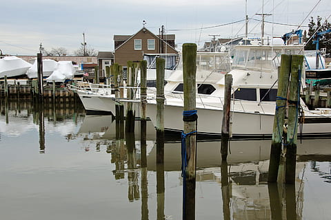 small, fishing boat, moored, dock, point, pleasant, new, jersey., fishing charters, charter fishing, deck boat, charter boat fishing, party boat fishing, small fishing boat, offshore fishing boats, deep sea fishing charters, commercial fishing boat, pictures of fishing boats, fishing boat images, water, reflection, building exterior, waterfront, built structure, architecture, transportation, nautical vessel, mode of transportation, no people, nature, building, day, residential district, lake, outdoors, sky, wooden post, sailboat, 2K, CC0, public domain, royalty free