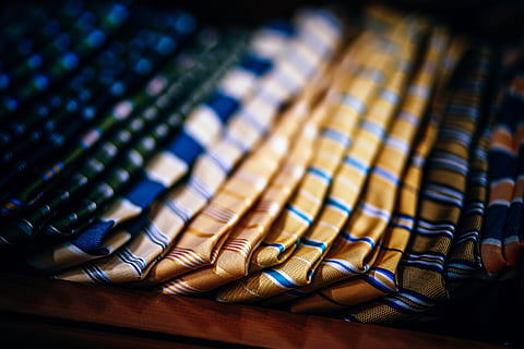luxurious ties, indoors, close-up, large group of objects, selective focus, no people, choice, in a row, focus on foreground, variation, abundance, vignette, wood - material, still life, pattern, order, pill, side by side, blue, table, backgrounds, 5K, CC0, public domain, royalty free