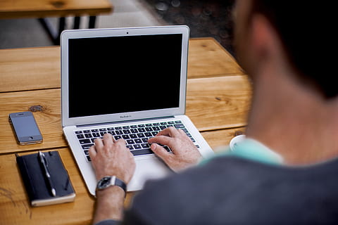 macbook air, laptop, computer, work, iphone, notepad, pen, typing, table, wood, technology, apple, business, office, desk, blogging, communication, wireless technology, using laptop, connection, adult, working, business person, males, men, internet, rear view, one person, indoors, over the shoulder view, young men, surfing the net, new business, 5K, CC0, public domain, royalty free