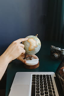 male, finger, showing, part, world, globe, geography, travel, hand, human hand, one person, laptop, human body part, holding, real people, technology, food and drink, computer, connection, wireless technology, communication, high angle view, table, food, indoors, lifestyles, adult, using laptop, keyboard, 5K, CC0, public domain, royalty free