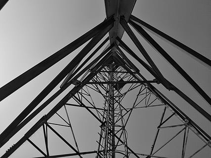 antenna, electrical device, cable, power lines, electric transmission tower, triangle, building, architecture, silhouette, tower, control tower, telescope, radio telescope, pattern, utility pole, oilfield, ornament, bracket, photo, photography, low angle view, sky, nature, built structure, metal, day, clear sky, outdoors, technology, no people, tall - high, connection, fuel and power generation, electricity pylon, directly below, electricity, power supply, complexity, girder, 4K, CC0, public domain, royalty free