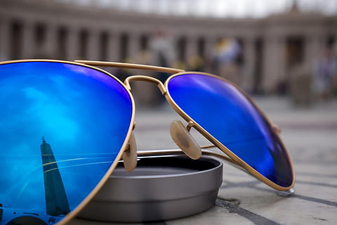 sunglasses, blue, reflection, objects, architecture, building exterior, day, built structure, no people, travel, focus on foreground, city, travel destinations, mode of transportation, close-up, outdoors, transportation, tourism, glasses, car, security, city life, 2K, CC0, public domain, royalty free