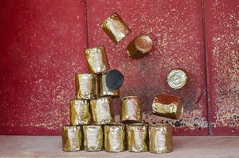 pile brass-colored cans, beige, surface, focus, motion, rustic, rusty, wall, coin, indoors, large group of objects, wealth, still life, finance, no people, gold colored, stack, metal, savings, colored background, studio shot, arrangement, choice, red, close-up, bolt, side by side, high angle view, 4K, CC0, public domain, royalty free