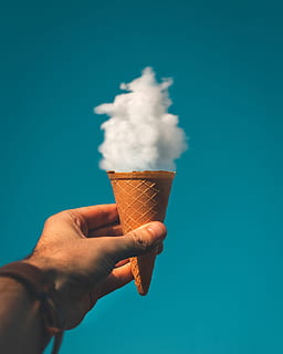 man, holding, ice cream cone, cloud, clouds, conceptual, cone, creative, food, hand, ice cream, outdoors, sky, sweet, human hand, human body part, one person, blue, food and drink, unrecognizable person, personal perspective, real people, lifestyles, body part, sweet food, human finger, indulgence, finger, temptation, blue background, human limb, 2K, CC0, public domain, royalty free