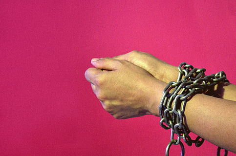 chained hands #2, concepts, creative, ideas, human body part, human hand, hand, colored background, bracelet, holding, people, studio shot, men, connection, copy space, crime, adult, wrist, positive emotion, human joint, close-up, emotion, red, 2K