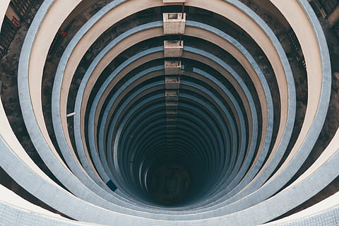 tunnel architecture, architecture, pattern, geometric shape, spiral, circle, shape, no people, close-up, curve, abstract, concentric, black color, indoors, built structure, metal, full frame, backgrounds, design, directly above, day, steel, 4K, CC0, public domain, royalty free