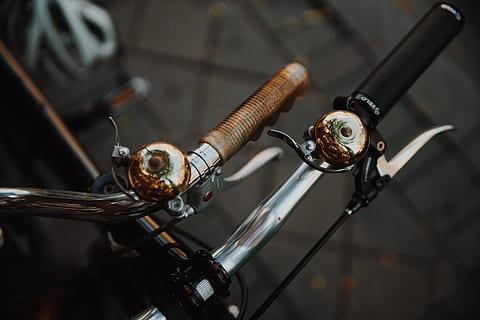 shiny, bike bells photo, Bike, Reflection, close-up, focus on foreground, bicycle, no people, transportation, mode of transportation, land vehicle, indoors, handlebar, metal, pedal, day, high angle view, old, technology, handle, equipment, selective focus, industry, 4K, CC0, public domain, royalty free