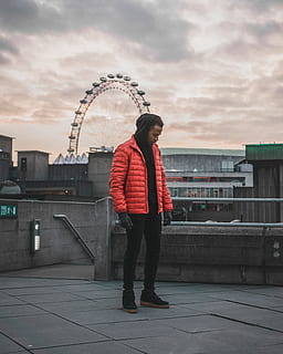 man, wearing, red, bubble jacket, architecture, real people, full length, building exterior, cloud - sky, sky, built structure, one person, lifestyles, standing, leisure activity, casual clothing, city, nature, women, young adult, young women, ferris wheel, day, outdoors, warm clothing, teenager, 4K, CC0, public domain, royalty free