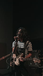man, singing, playing, guitar, performance, music, arts culture and entertainment, input device, musician, microphone, one person, indoors, artist, musical instrument, skill, singer, holding, musical equipment, long hair, real people, rock musician, stage, hairstyle, nightlife, entertainment occupation, concert, 5K, CC0, public domain, royalty free
