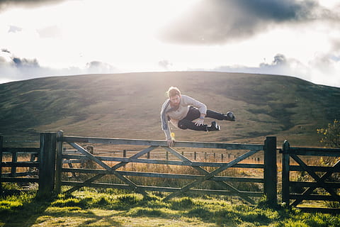 man, jumping, fence, field photo, Men, Nature and Landscapes, Travel, Adventure, Trip, full length, one person, nature, mountain, sky, barrier, day, boundary, grass, adult, leisure activity, landscape, casual clothing, sunlight, women, cloud - sky, outdoors, 4K, CC0, public domain, royalty free