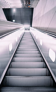 gray, escalator, inside, mall, architecture, illuminated, transportation, the way forward, direction, railing, steps and staircases, indoors, built structure, convenience, staircase, lighting equipment, modern, technology, moving walkway, diminishing perspective, no people, futuristic, low angle view, ceiling, silver colored, 5K, CC0, public domain, royalty free