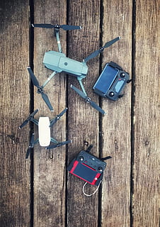 two, assorted, quadcopter drones, controllers, control, drone, electronics, equipment, propellers, technology, wood, wooden, wood - material, no people, still life, directly above, high angle view, hanging, table, day, metal, indoors, communication, clothespin, work tool, tool, group of objects, close-up, 1080P, CC0, public domain, royalty free
