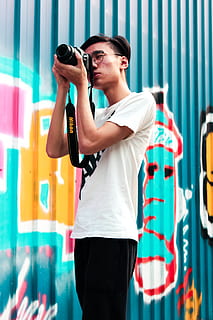 man, using, dlsr camera, standing, one person, three quarter length, young adult, young women, front view, casual clothing, adult, leisure activity, women, lifestyles, real people, looking, holding, photography themes, technology, day, camera - photographic equipment, hairstyle, photographer, 5K, CC0, public domain, royalty free