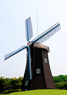 brown windmill, antique, architecture, blue, brown, building, energy, environment, farm, field, forest, grass, green, landscape, mill, scene, scenery, technology, traditional, trees, typical, wind, windmill, wooden, renewable energy, alternative energy, wind power, turbine, wind turbine, fuel and power generation, sky, environmental conservation, traditional windmill, nature, built structure, clear sky, no people, plant, low angle view, building exterior, outdoors, sustainable resources, 4K, CC0, public domain, royalty free