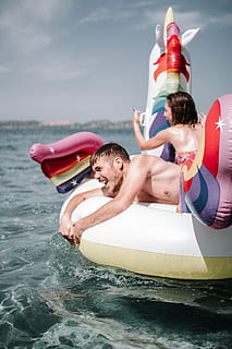 couple, inflatable raft, beach, enjoyment, fun, guy, happy, leisure, ocean, outdoors, people, recreation, sea, vacation, water, woman, men, nature, leisure activity, day, togetherness, happiness, sport, holiday, inflatable, males, smiling, lifestyles, vacations, tube, floating on water, 5K, CC0, public domain, royalty free