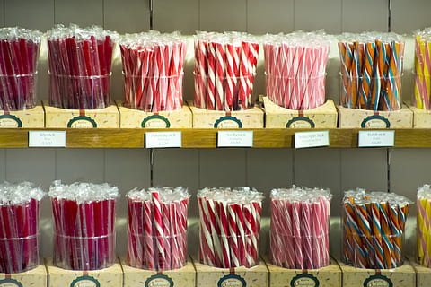 candy, pink, sweets, store, retail, large group of objects, in a row, hanging, multi colored, indoors, choice, no people, variation, order, side by side, food and drink, red, abundance, sale, food, arrangement, business, group of objects, 5K, CC0, public domain, royalty free