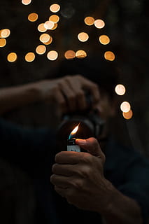 person, holding, lighted, disposable, lighter, flame, hand, macro, outdoorchallenge, burning, fire, illuminated, fire - natural phenomenon, human hand, night, focus on foreground, heat - temperature, human body part, glowing, lifestyles, one person, close-up, nature, indoors, celebration, 5K, CC0, public domain, royalty free