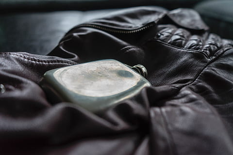 jacket, flask, edc, clothing, close-up, textile, no people, indoors, selective focus, still life, textured, leather, bag, focus on foreground, uniform, furniture, old, single object, dark, protection, garment, jeans, 5K, CC0, public domain, royalty free