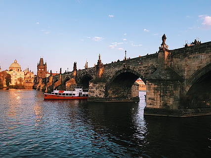 gray brick bridge, ancient, architecture, boat, bridge, buildings, castle, clouds, daylight, fortification, historic, landmark, low angle shot, river, sailing, sight, sky, sunset, tourism, town, water, watercraft, built structure, transportation, connection, bridge - man made structure, building exterior, waterfront, arch, mode of transportation, nautical vessel, arch bridge, nature, travel, city, travel destinations, no people, passenger craft, outdoors, arched, 4K, CC0, public domain, royalty free