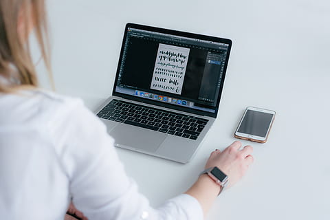 laptop, pc, electronics, computer, mobile phone, cell phone, phone, computer hardware, computer keyboard, hardware, keyboard, screen, human, person, monitor, lcd screen, display, shirt, hand, mouse, technology, wireless technology, communication, connection, adult, women, using laptop, one person, indoors, internet, young adult, young women, table, business, computer network, blond hair, 5K, CC0, public domain, royalty free