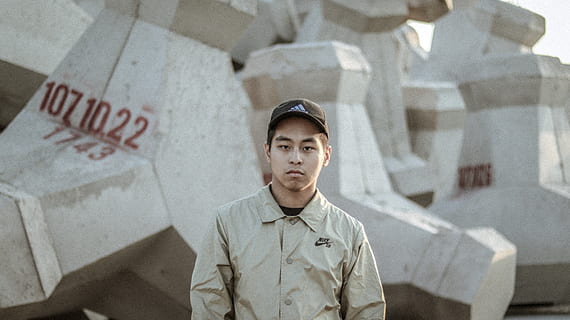 man, wearing, beige, collared, jacket, front view, one person, looking at camera, portrait, young adult, young men, architecture, standing, waist up, day, wall - building feature, lifestyles, text, real people, leisure activity, casual clothing, built structure, indoors, adolescence, uniform, government, teenager, 5K, CC0, public domain, royalty free