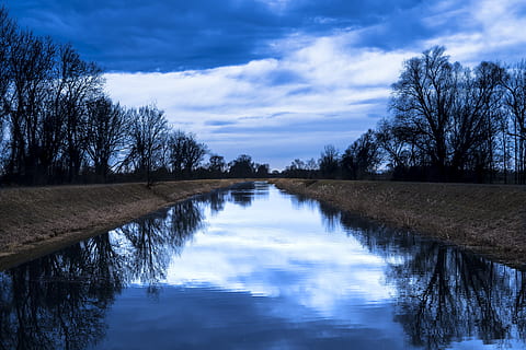 river between trees, beautiful, blue sky, clouds, cloudscape, daylight, grass, landscape, mood, nature, reflection, scenic, sky, trees, water, weather, woods, tree, cloud - sky, tranquility, tranquil scene, scenics - nature, beauty in nature, plant, bare tree, no people, lake, waterfront, non-urban scene, blue, outdoors, 5K, CC0, public domain, royalty free