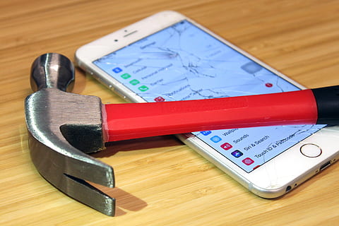 apple, iphone, broken, screen, hammer, smartphone, indoors, wood - material, table, still life, high angle view, no people, close-up, equipment, metal, work tool, tool, wood, education, number, pencil, hand tool, focus on foreground, pen, 4K, CC0, public domain, royalty free