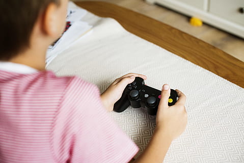 photo, person, holding, black, wireless, controller, alone, blur, console, depth of field, electronic, entertainment, focus, game, games, gaming, hand, indoors, leisure, play, playing, recreation, technology, one person, women, adult, human body part, close-up, young adult, occupation, casual clothing, rear view, pink color, striped, selective focus, young women, females, expertise, human hand, 4K, CC0, public domain, royalty free