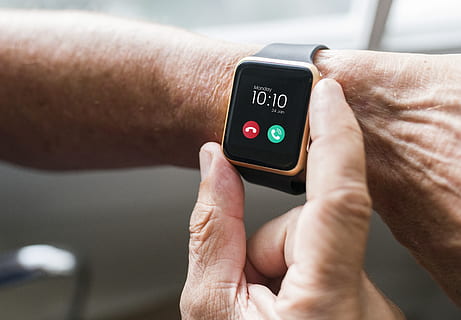 gold-colored smartwatch, arm, checking, device, digital device, gadget, hands, man, smart watch, technology, time, touch, touching, human hand, hand, human body part, one person, wireless technology, wearable computer, lifestyles, communication, adult, close-up, real people, body part, number, mobile app, day, healthcare and medicine, watch, finger, wristwatch, checking the time, 2K, CC0, public domain, royalty free