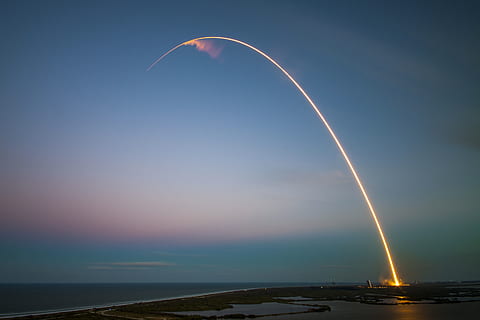 rockets, rocket ship, space, shuttle, sunset, dusk, sky, lights, beauty in nature, water, cloud - sky, sea, scenics - nature, nature, no people, horizon, horizon over water, tranquil scene, tranquility, motion, vapor trail, illuminated, outdoors, blue, transportation, long exposure, 2K, CC0, public domain, royalty free