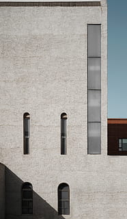 gray concrete building, wall, brick, home decor, window, building, architecture, concrete, banister, handrail, clothing, apparel, tower, vehicle, transportation, dome, curtain, window shade, path, walkway, office building, building exterior, built structure, day, no people, outdoors, wall - building feature, sunlight, nature, side by side, city, rectangle, gray, low angle view, in a row, residential district, design, apartment, 5K, CC0, public domain, royalty free