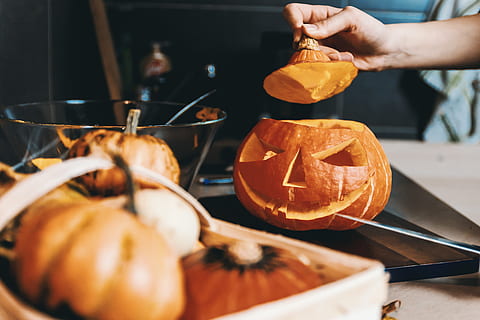girls hands, carve, pumpkin., halloween., food and drink, food, holding, human hand, freshness, healthy eating, hand, preparation, pumpkin, one person, human body part, orange color, wellbeing, close-up, indoors, adult, preparing food, selective focus, halloween, jack o' lantern, orange, 4K