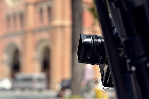fuji, focus on foreground, photography themes, camera - photographic equipment, close-up, technology, black color, no people, day, photographic equipment, architecture, built structure, building exterior, digital camera, camera, outdoors, arts culture and entertainment, city, photographing, security, equipment, 2K, CC0, public domain, royalty free