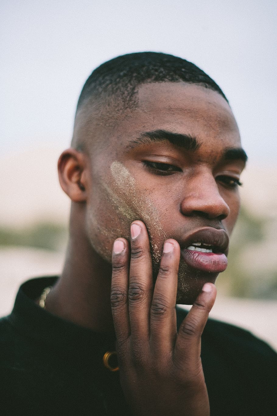 man, standing, touching, cheek, headshot, one person, real people, portrait, young men, young adult, lifestyles, front view, focus on foreground, leisure activity, men, close-up, human body part, body part, day, human face, beard, human hand, hand, contemplation, 4K