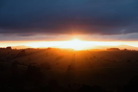 sunset, shade, trees, hill, scenics - nature, beauty in nature, sky, tranquil scene, sun, tranquility, environment, sunlight, landscape, sunbeam, mountain, idyllic, nature, cloud - sky, non-urban scene, lens flare, orange color, no people, tree, outdoors, bright, 5K, CC0, public domain, royalty free