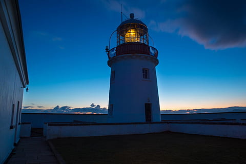 light tower, architecture, building, light, lighthouse, sky, tower, guidance, built structure, building exterior, protection, security, direction, safety, dusk, night, illuminated, nature, no people, blue, sea, cloud - sky, outdoors, 720P, CC0, public domain, royalty free
