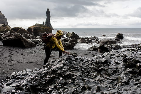 person, wearing, hoodie, touching, stone, seashore, action, beach, landscape, motion, ocean, outdoors, rock, sand, sea, sunset, surf, travel, water, wave, sky, land, horizon over water, rock - object, solid, horizon, nature, cloud - sky, beauty in nature, full length, real people, day, lifestyles, rear view, people, 5K, CC0, public domain, royalty free