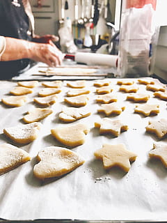 assorted-shaped dough, baker, bakery, baking, bread, dough, flour, food, mobilechallenge, pastry, preparation, food and drink, freshness, preparing food, indoors, occupation, kitchen, baked, sweet food, one person, cookie, commercial kitchen, domestic room, real people, chef, midsection, baking sheet, hand, skill, food and drink establishment, 2K, CC0, public domain, royalty free