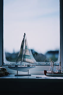 still, items, things, miniature, scale, model, ship, sail, display, collection, window, pane, view, bokeh, transportation, mode of transportation, water, no people, glass - material, day, transparent, nature, architecture, built structure, nautical vessel, sky, focus on foreground, sailboat, outdoors, travel, connection, yacht, 5K, CC0, public domain, royalty free