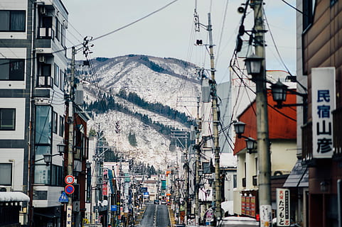 empty, highway, daytime, road, nature, outdoors, person, human, tarmac, asphalt, way, transportation, snow, vehicle, ice, water, intersection, ocean, sea, weather, pedestrian, urban, building exterior, architecture, built structure, city, building, cable, mountain, electricity, sky, day, mode of transportation, street, power line, residential district, no people, power supply, complexity, 5K, CC0, public domain, royalty free