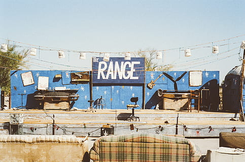 music, stage, show, instruments, guitar, sofas, couches, chair, buckets, text, clear sky, architecture, sky, communication, day, built structure, building exterior, nature, western script, no people, sunlight, sign, outdoors, city, building, information, graffiti, non-western script, script, 2K, CC0, public domain, royalty free
