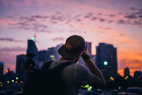 shooting, photo, City, Sunset, Camera, Photographer, building exterior, architecture, built structure, sky, one person, rear view, city life, focus on foreground, building, illuminated, office building exterior, headshot, portrait, cityscape, nature, cloud - sky, skyscraper, outdoors, purple, 4K, CC0, public domain, royalty free