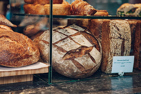 baked breads, food and drink, food, freshness, bread, still life, healthy eating, baked, store, close-up, for sale, wellbeing, no people, indoors, retail, loaf of bread, brown, bakery, retail display, ready-to-eat, focus on foreground, temptation, 5K, CC0, public domain, royalty free