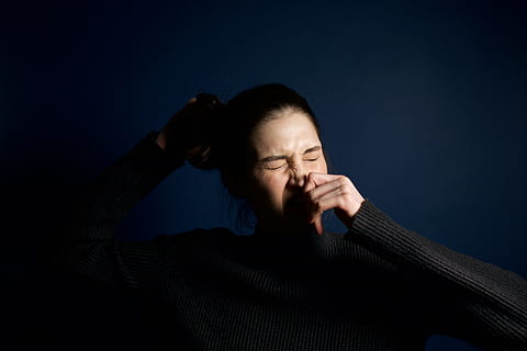 woman, touching, nose, adult, black, blue, dark, emotion, facial expression, girl, hair, hand, person, sneeze, sneezing, studio, sweater, wear, one person, portrait, indoors, studio shot, eyes closed, negative emotion, sadness, headshot, colored background, human body part, emotional stress, mature adult, body part, contemplation, human face, depression - sadness, hairstyle, black background, aggression, 5K