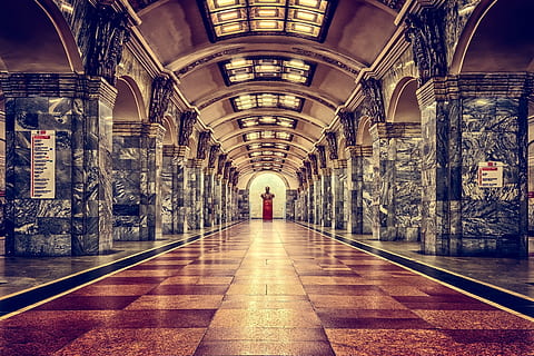 railway station, metro, st petersburg, russia, architecture, urban, trainstation, station, stop, subway, platform, metro station, lenin, bust, sculpture, leningrad, underground, symmetry, direction, the way forward, indoors, arch, one person, built structure, illuminated, real people, rear view, diminishing perspective, flooring, full length, lifestyles, walking, lighting equipment, ceiling, transportation, incidental people, tiled floor, architectural column, 5K