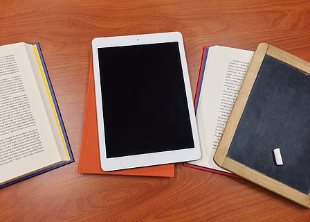 learning, tablet, education, technology, school, table, publication, book, wireless technology, wood - material, indoors, connection, high angle view, screen, communication, still life, paper, digital tablet, portable information device, no people, mobile phone, smart phone, touch screen, blank, note pad, e-reader, 2K, CC0, public domain, royalty free