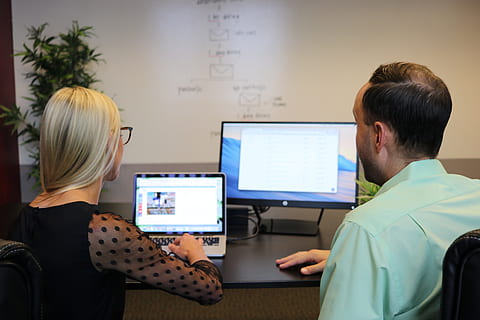 woman, using, laptop computer, rear view, technology, computer, occupation, indoors, real people, sitting, men, communication, adult, working, people, two people, women, office, casual clothing, connection, males, computer equipment, coworker, 5K, CC0, public domain, royalty free